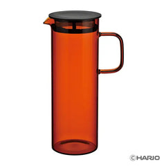 Orange HARIO Colors cold brew pitcher with black mesh filter lid, empty against white background.