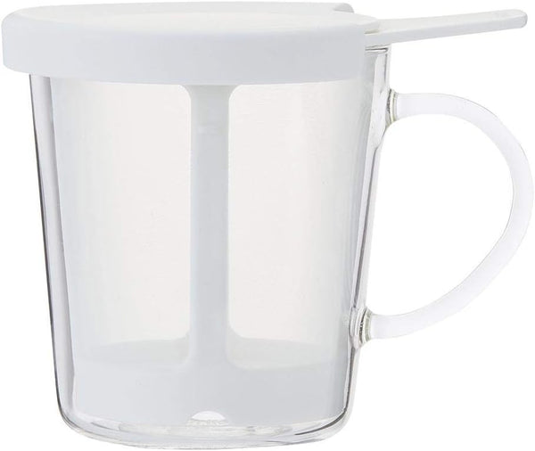Clear glass one-cup tea maker with white lid and handle, viewed from front angle