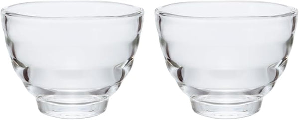 Set of two empty Yunomi glasses displayed on white background showing paired design