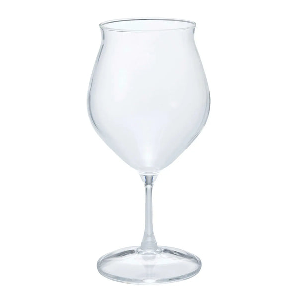 Empty clear glass tulip-shaped tumbler with heat-resistant design on white background.