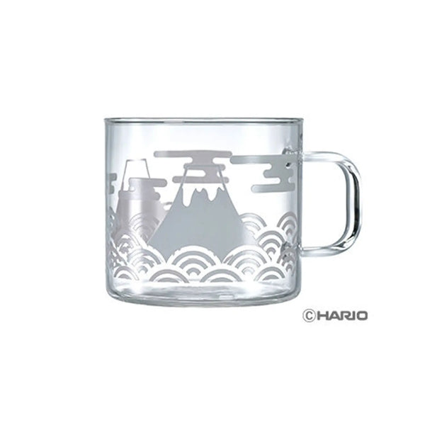 Clear glass mug with Mount Fuji illustration in gray and wavy cloud pattern design.