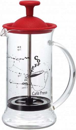 Hario Cafepress Slim S with red lid, clear glass cylinder showing coffee measurement markings and metal plunger mechanism.