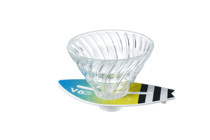 V60 dripper on lime-to-teal surfboard base with black-striped wing design detail.