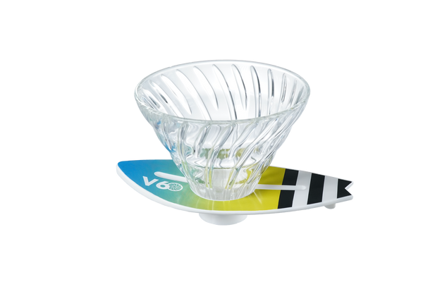 V60 dripper on lime-to-teal surfboard base with black-striped wing design detail.