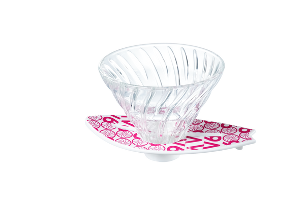 V60 dripper on magenta surfboard base featuring ornamental swirl pattern throughout.