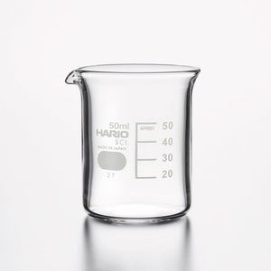 Empty 50ml HARIO glass beaker with gradation markings on white.