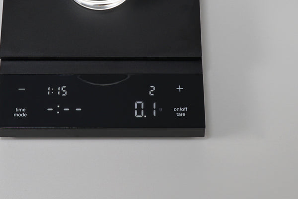 Close-up of black Polaris scale display panel with digital readout and control buttons