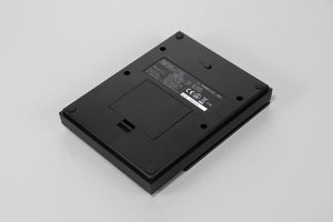 Back view of black Polaris scale showing battery compartment and regulatory markings