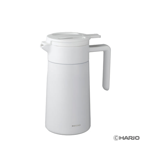 White ceramic-coated thermal server with lid and handle against plain white background for product showcase