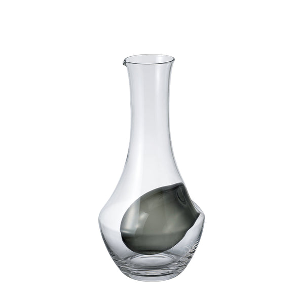 Clear glass carafe with bulbous ice well chamber containing dark liquid, front view.