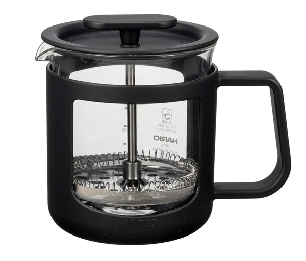 Black Hario coffee press with glass carafe and metal plunger shown front view on white background