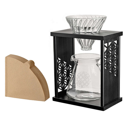 Black drip stand with included light wood filter holder accessory displayed beside the stand.