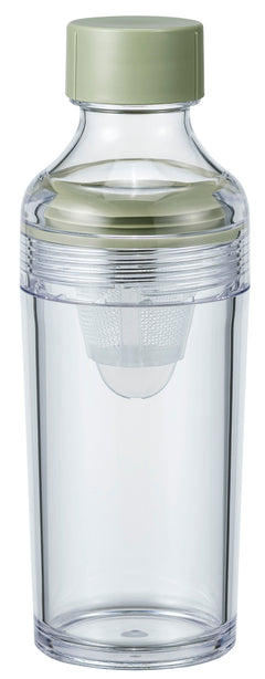 Clear glass bottle with pale green cap and internal mesh filter basket