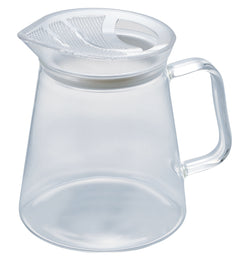Clear glass teapot with handle, featuring mesh filter insert visible at the top rim.