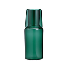 Dark green glass carafe with inverted cup lid shown in front view against white.