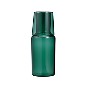 Dark green glass carafe with inverted cup lid shown in front view against white.