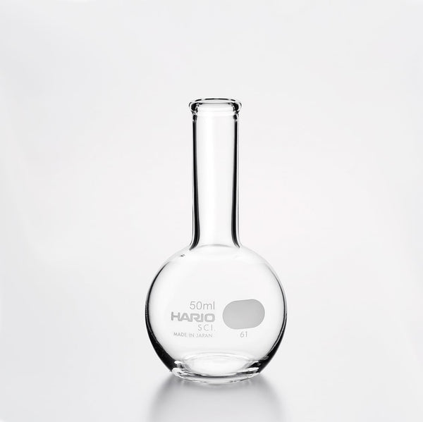 Empty Hario flask vase 50ml with narrow neck and round base on neutral background.
