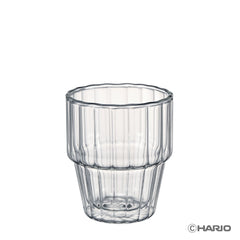 Single clear double-walled glass with vertical ribbed texture and horizontal band detail, shown against white background.