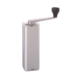Silver Hario Prism coffee mill with side-mounted crank handle and black grip
