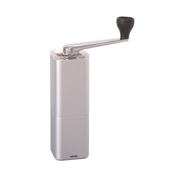 Silver Hario Prism coffee mill with side-mounted crank handle and black grip