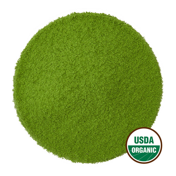 Bright green matcha powder in perfectly round pile with USDA Organic seal.