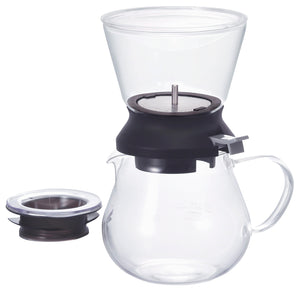 Assembled Largo dripper set with clear glass upper and lower vessels separated by black dripper mechanism.