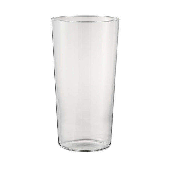 Empty thin-walled cylindrical glass with wider body on white background.