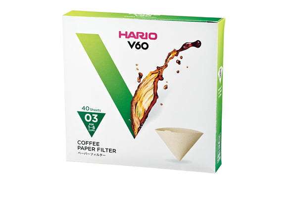 HARIO V60 coffee filter box with green trim, size 03, 40 sheets, showing beige filter.