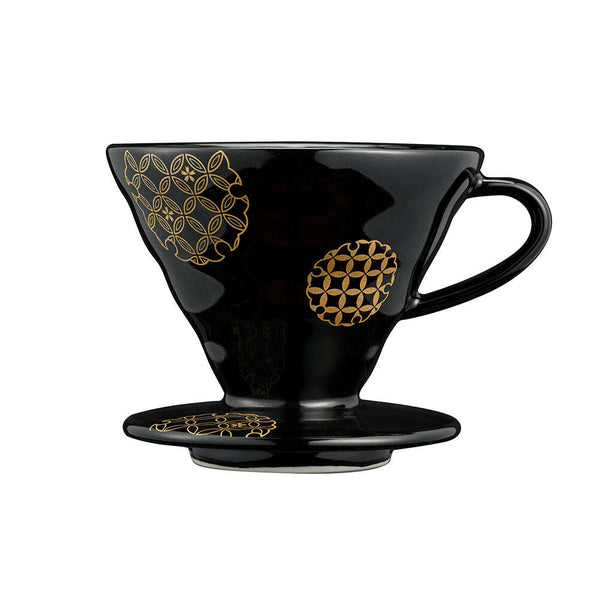 Black ceramic V60 dripper with gold geometric pattern on pedestal base