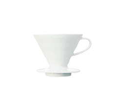 White ceramic V60 02 dripper with conical interior and pedestal base against plain white background