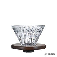 Walnut Series V60 glass dripper with ribbed cone design and dark wood base, shown against white background.
