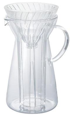 Clear glass pour-over coffee maker with ridged cone top and handle, shown empty against white background.