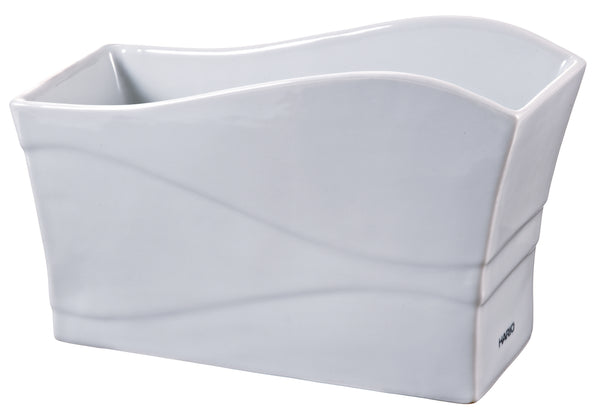 White ceramic paper filter stand with curved sides and angled bottom design