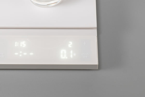 Close-up of white Polaris scale display panel showing time, weight, and control icons