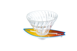 V60 dripper on blue-to-orange striped surfboard base, angled product shot.