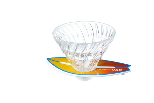 V60 dripper on blue-to-orange striped surfboard base, angled product shot.