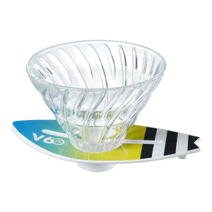 V60 dripper on turquoise-to-lime surfboard base with black and white stripe accents.